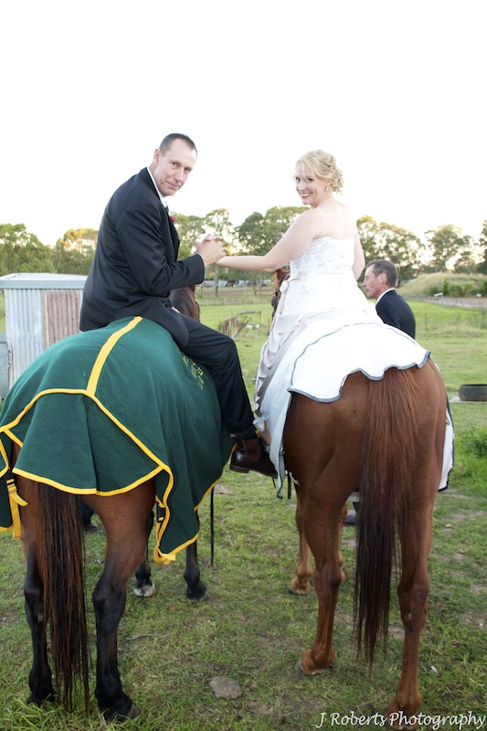 Bride and groom on horseback - wedding photography sydney